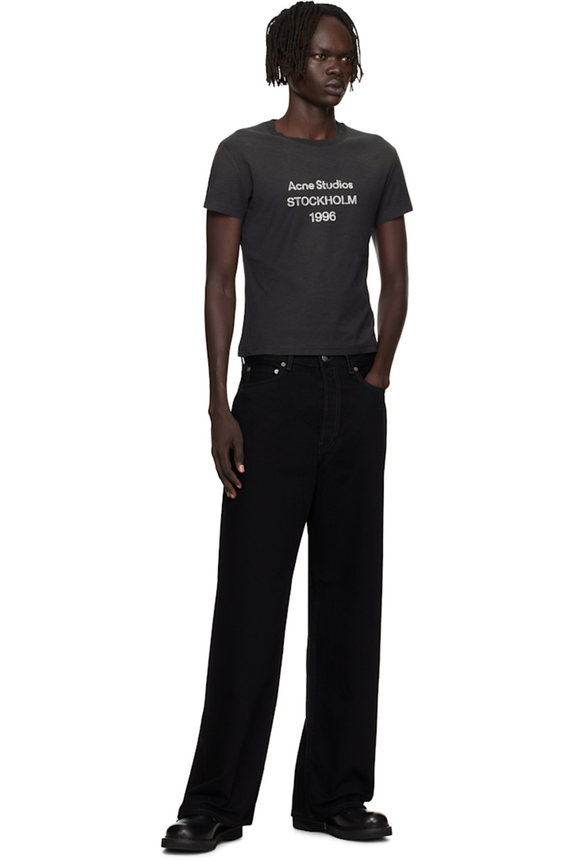 Non-stretch organic cotton denim jeans. 

· Wide-leg
· Belt loops
· Five-pocket styling
· Button fly
· Leather logo patch at back waistband
· Logo-engraved antiqued silver-tone hardware

Supplier color: Black