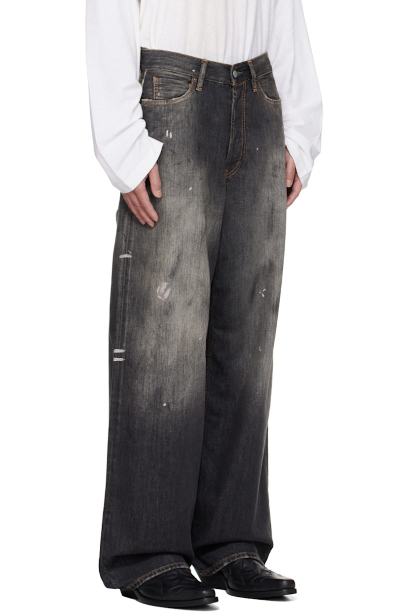 Non-stretch organic cotton denim jeans.

· Fading, distressing, and paint splatter throughout
· Loose-fit
· Belt loops
· Five-pocket styling
· Button fly
· Logo patch at back waistband
· Contrast stitching in tan

Supplier color: Black