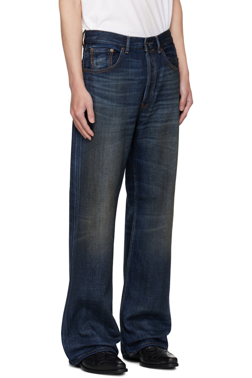 Non-stretch denim jeans.

· Fading, smudging, and whiskering throughout
· Belt loops
· Detachable denim belt at waistband
· Five-pocket styling
· Button fly
· Leather logo patch at back waistband
· Contrast stitching in brown 

Supplier color: Dark blue