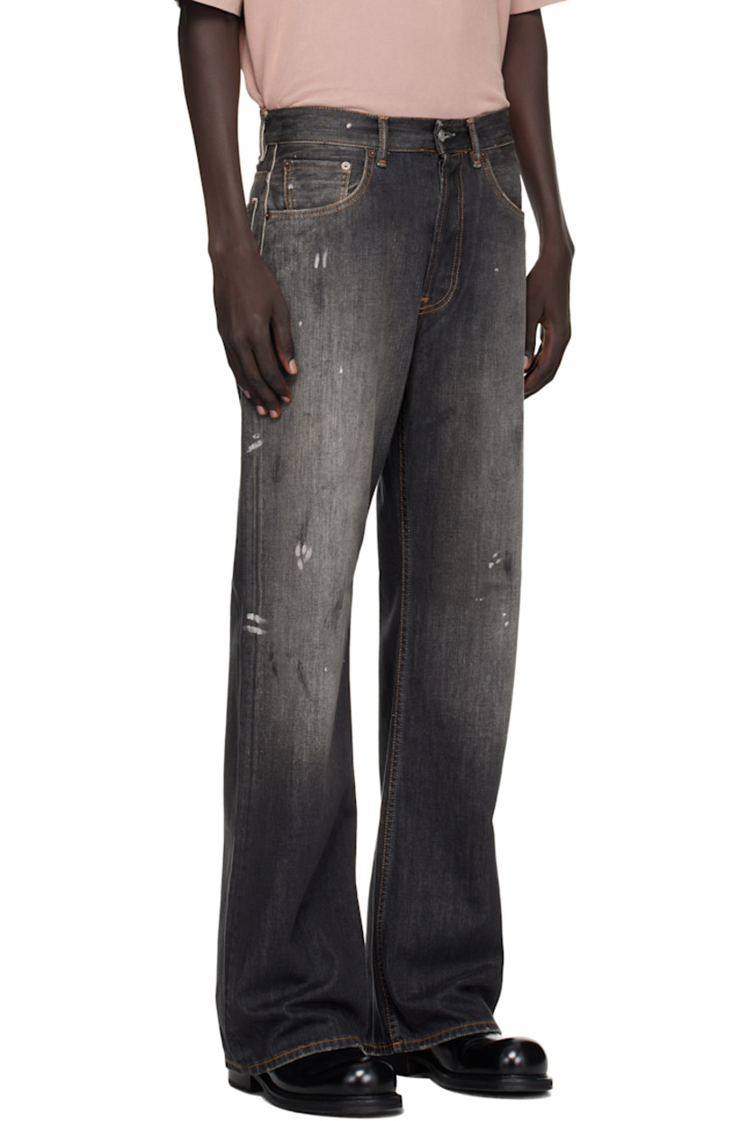Non-stretch organic cotton denim jeans.

· Fading, paint splatters, distressing, and smudging throughout
· Straight-leg
· Mid-rise
· Belt loops
· Five-pocket styling
· Button fly
· Leather logo patch at back waistband
· Logo-engraved copper- and silver-tone hardware
· Contrast stitching in tan

Supplier color: Black