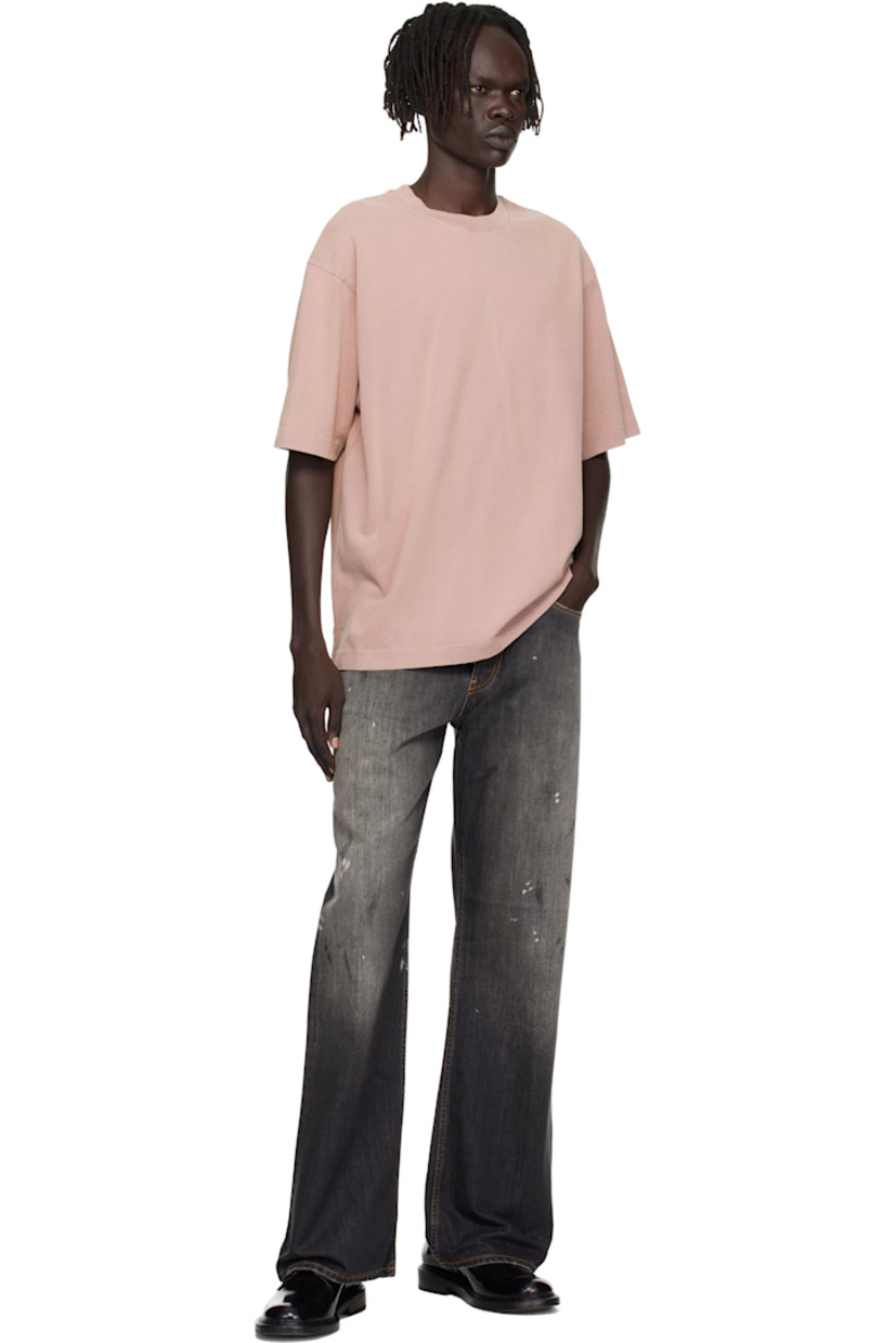 Non-stretch organic cotton denim jeans.

· Fading, paint splatters, distressing, and smudging throughout
· Straight-leg
· Mid-rise
· Belt loops
· Five-pocket styling
· Button fly
· Leather logo patch at back waistband
· Logo-engraved copper- and silver-tone hardware
· Contrast stitching in tan

Supplier color: Black