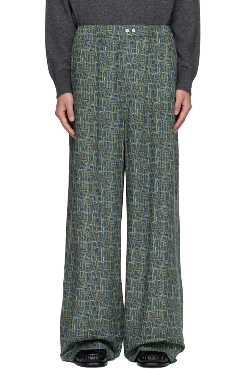 Viscose twill trousers.

· Logo pattern printed throughout
· Wide-leg
· Mid-rise
· Buttons at elasticized waistband
· Three-pocket styling
· Logo embroidered at back

Supplier color: Blue multi