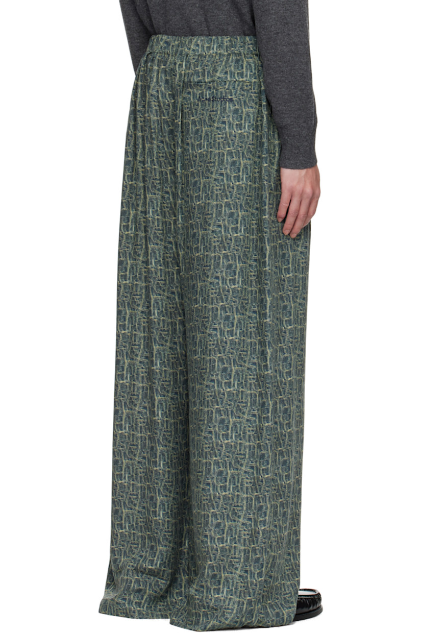 Viscose twill trousers.

· Logo pattern printed throughout
· Wide-leg
· Mid-rise
· Buttons at elasticized waistband
· Three-pocket styling
· Logo embroidered at back

Supplier color: Blue multi