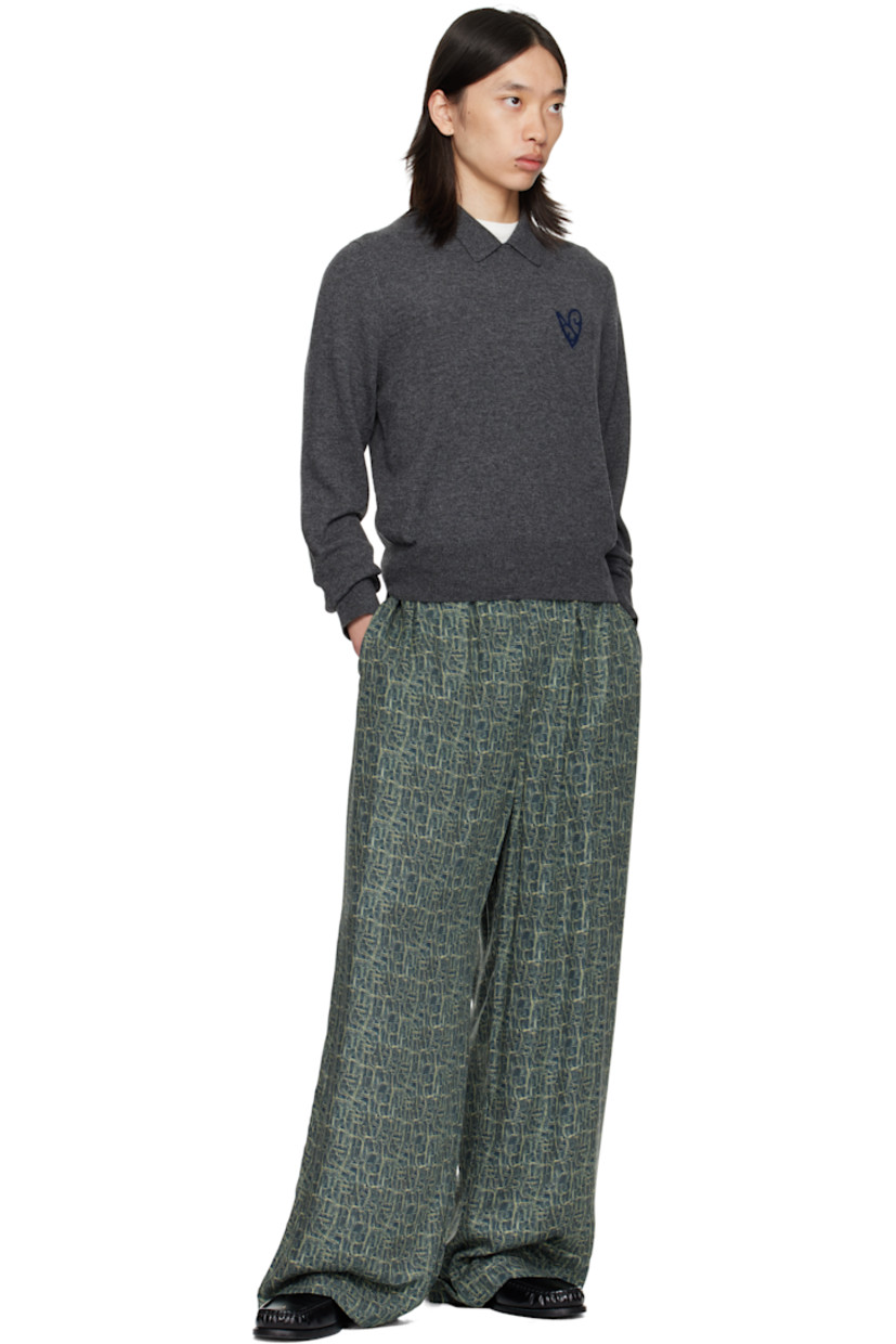 Viscose twill trousers.

· Logo pattern printed throughout
· Wide-leg
· Mid-rise
· Buttons at elasticized waistband
· Three-pocket styling
· Logo embroidered at back

Supplier color: Blue multi