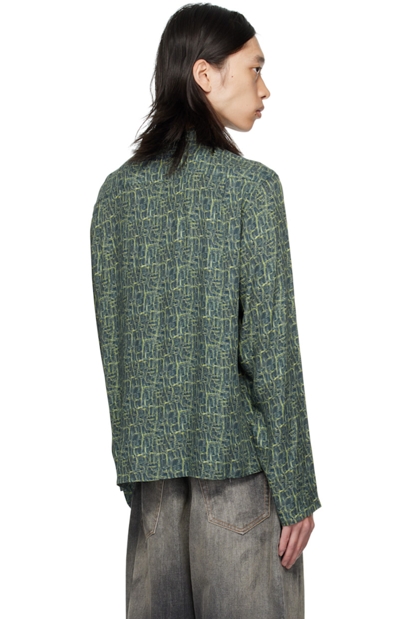 Viscose twill shirt. 

· Graphic pattern printed throughout 
· Spread collar 
· Logo embroidered at back collar 

Supplier color: Blue multi