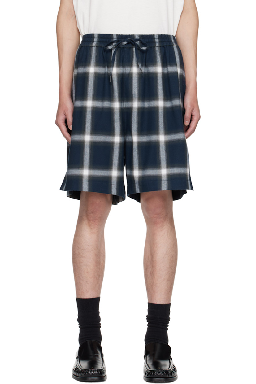 Cotton flannel shorts.

· Check pattern throughout
· Drawstring at elasticized waistband
· Three-pocket styling
· Vented cuffs
· Logo embroidered at back pocket

Supplier color: Navy/Multi