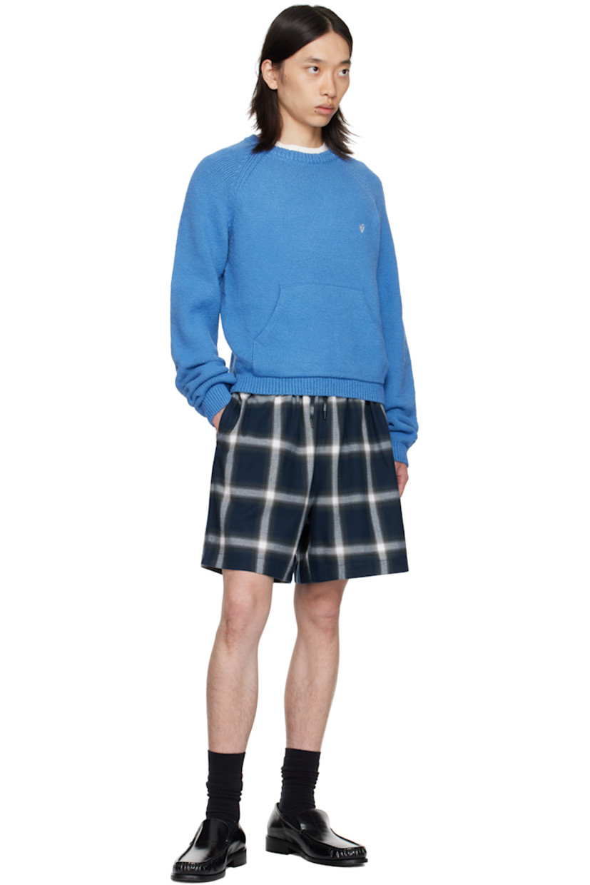 Cotton flannel shorts.

· Check pattern throughout
· Drawstring at elasticized waistband
· Three-pocket styling
· Vented cuffs
· Logo embroidered at back pocket

Supplier color: Navy/Multi