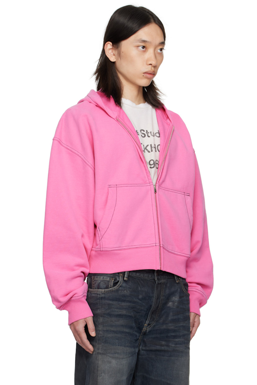Organic cotton fleece hoodie.

· Zip closure
· Patch pockets at front
· Rib-knit hem and cuffs
· Dropped shoulders
· Logo embroidered at back
· Contrast stitching in black

Supplier color: Pink
