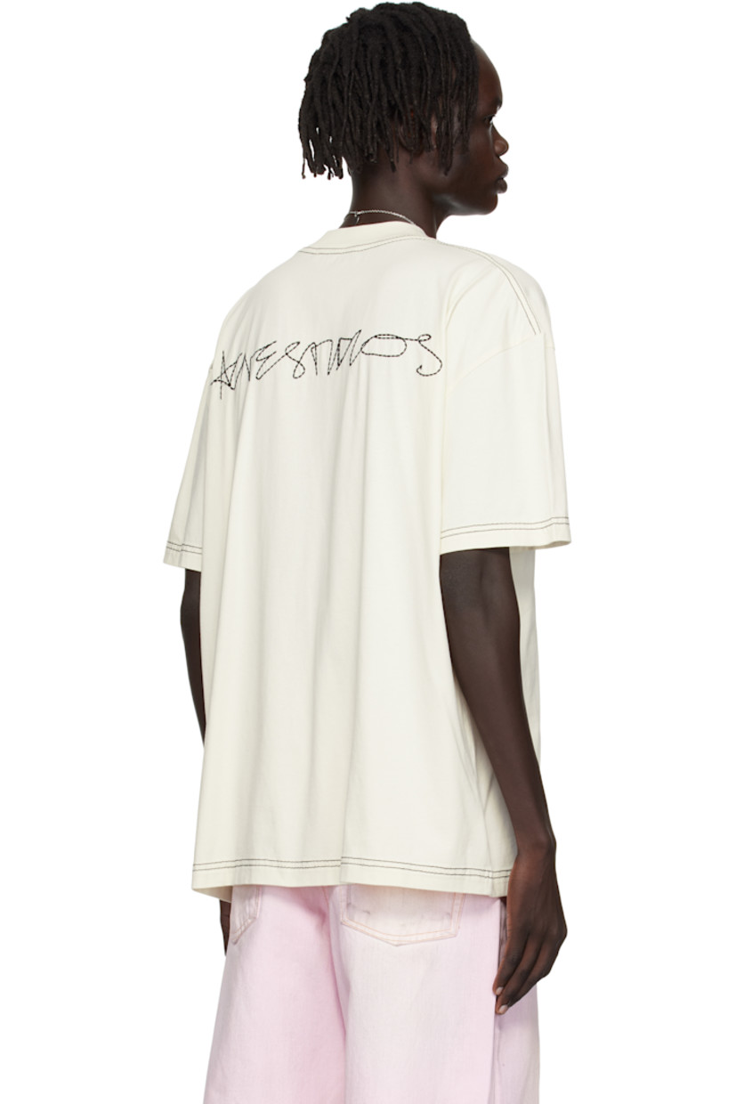 Organic cotton jersey T-shirt.

· Rib-knit crewneck
· Dropped shoulders
· Logo embroidered at back
· Contrast stitching in black

Supplier color: Off white