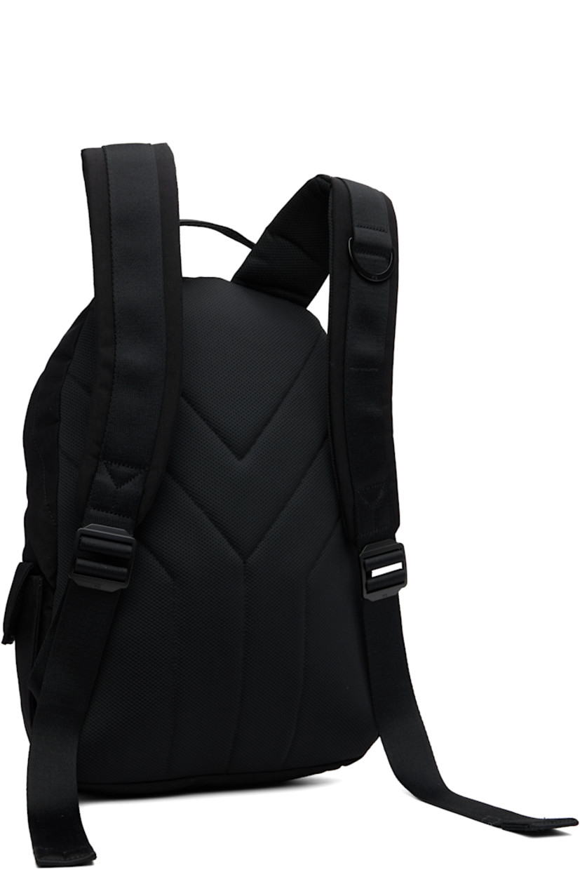 Nylon canvas and mesh backpack. 

· Rolled carry handle
· Adjustable padded shoulder straps
· Bonded logo and patch pocket at side
· Flap pocket at sides
· Padded back face 
· Two-way zip closure
· D-ring, zip pocket, and laptop compartment 
· Twill lining
· H17" x W12" x D5" / 35 L 

Supplier color: Black