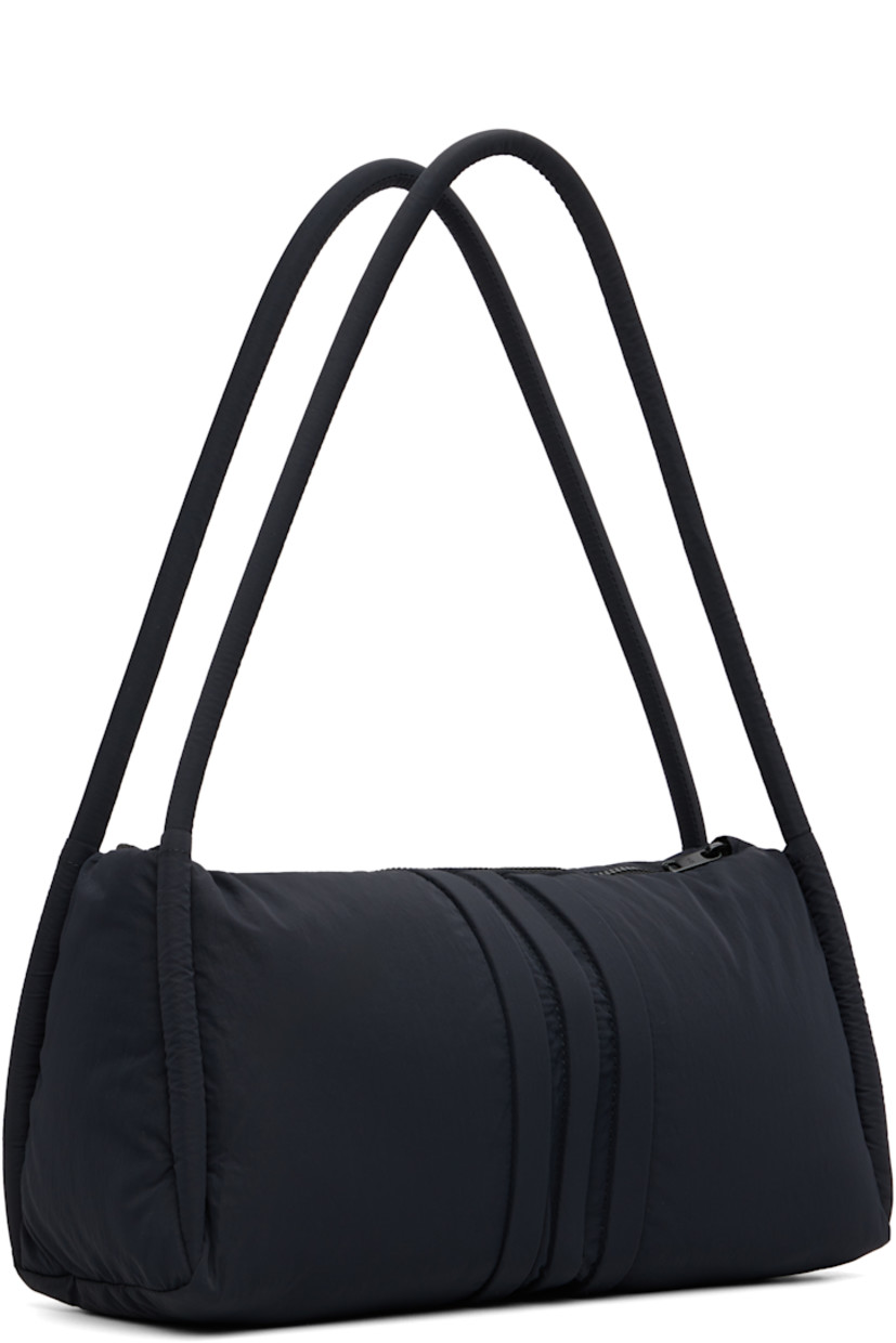 Padded recycled nylon taffeta pouch. 

· Twin rolled shoulder straps
· Signature stripes at front and back
· Embroidered logo at side
· Zip closure
· Zip pocket at interior 
· Twill lining
· Logo-engraved hardware
· H8" x W11" x D4"/ 30 L 

Supplier color: Black