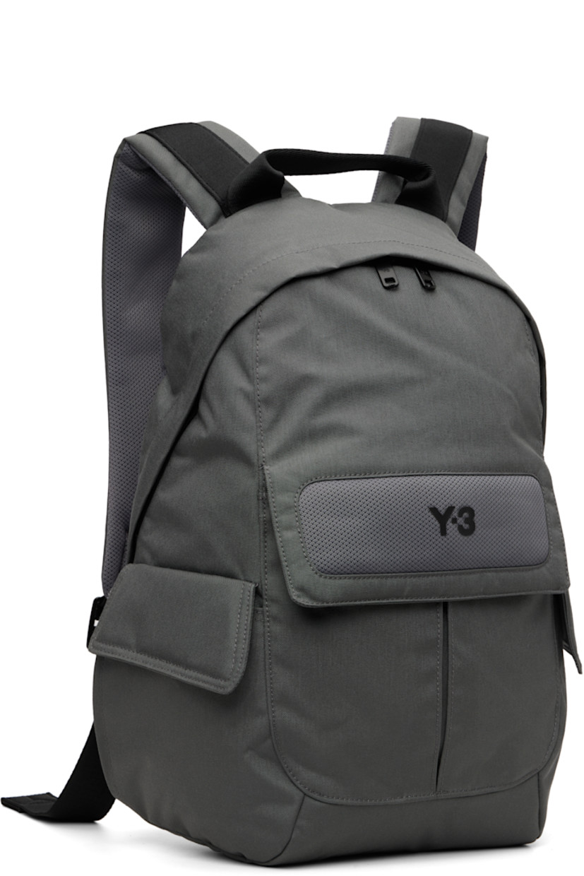 CORDURA® canvas backpack.

· Fixed carry handle
· Adjustable padded shoulder straps
· D-ring at strap
· Mesh panel with bonded logo at face
· Flap pocket at face and sides
· Padded mesh back face
· Two-way zip closure
· D-ring and zip pocket at interior
· Laptop compartment
· Twill lining
· H17" x W14" x D4.5" / 35 L

Supplier color: Granite