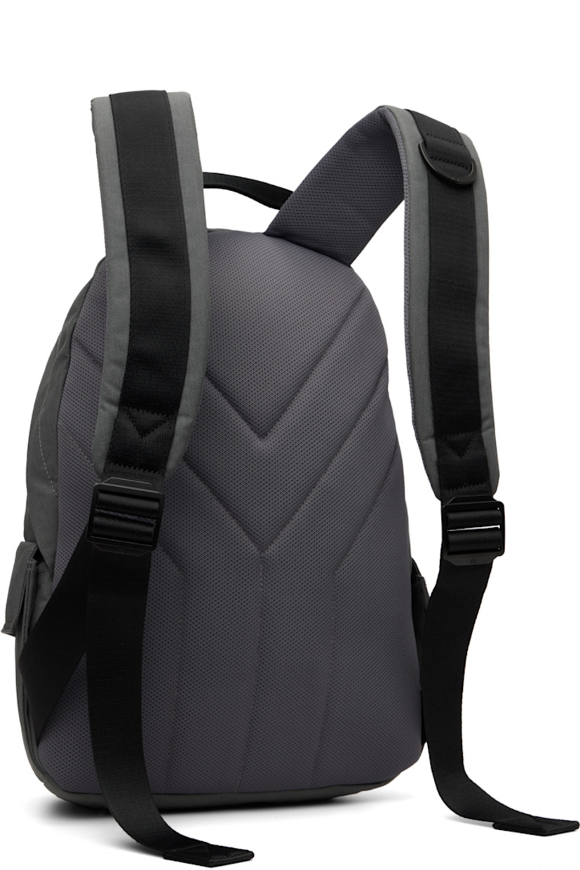 CORDURA® canvas backpack.

· Fixed carry handle
· Adjustable padded shoulder straps
· D-ring at strap
· Mesh panel with bonded logo at face
· Flap pocket at face and sides
· Padded mesh back face
· Two-way zip closure
· D-ring and zip pocket at interior
· Laptop compartment
· Twill lining
· H17" x W14" x D4.5" / 35 L

Supplier color: Granite