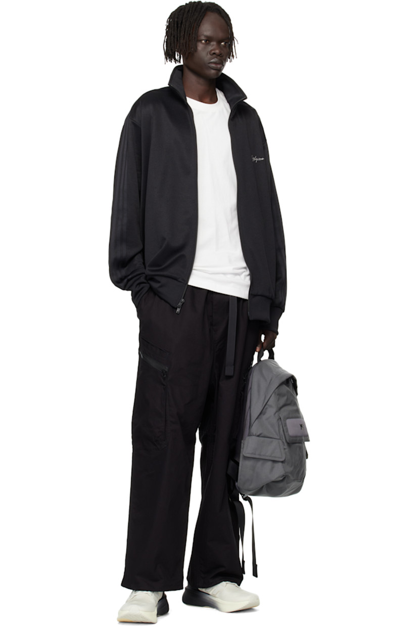 CORDURA® canvas backpack.

· Fixed carry handle
· Adjustable padded shoulder straps
· D-ring at strap
· Mesh panel with bonded logo at face
· Flap pocket at face and sides
· Padded mesh back face
· Two-way zip closure
· D-ring and zip pocket at interior
· Laptop compartment
· Twill lining
· H17" x W14" x D4.5" / 35 L

Supplier color: Granite