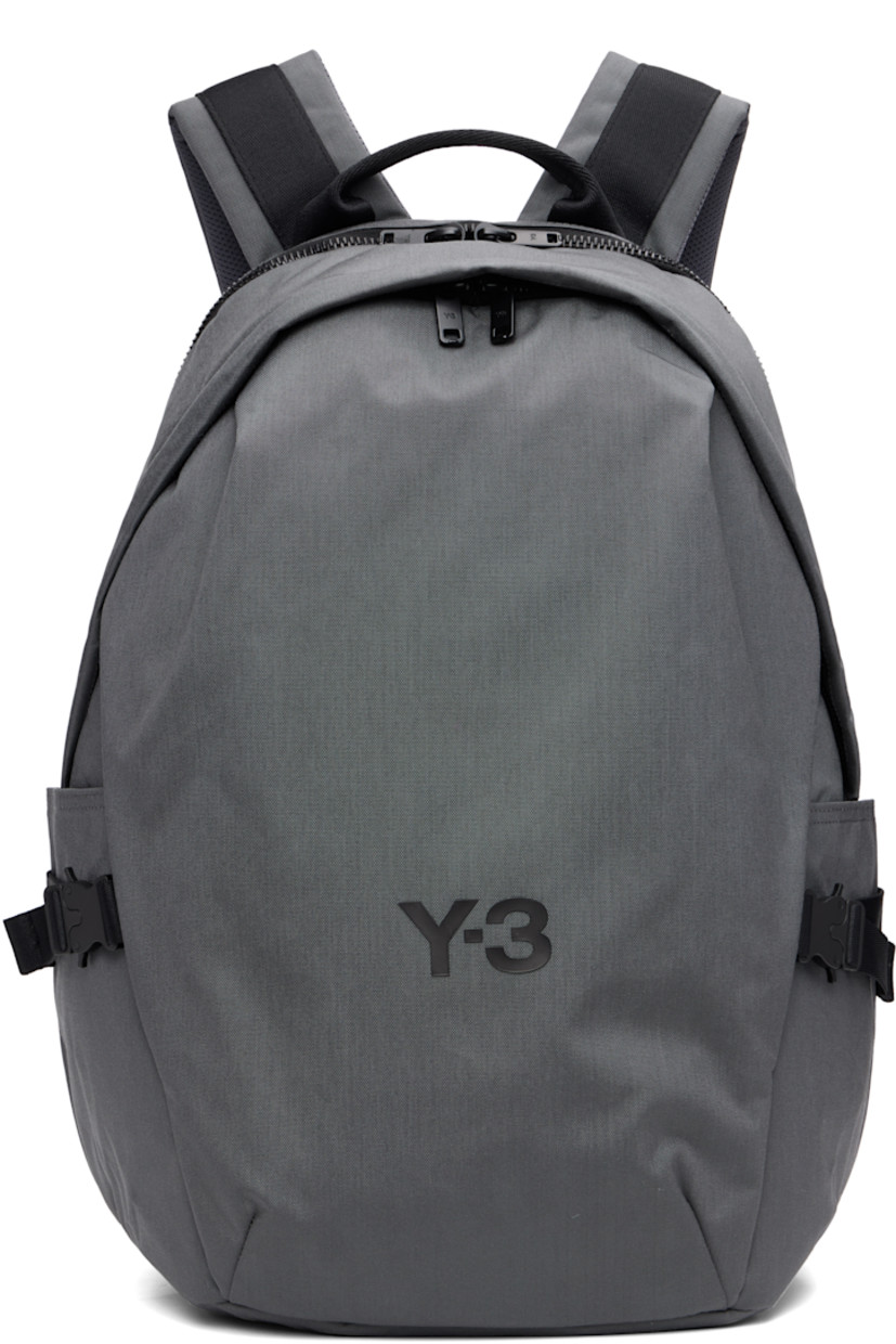 CORDURA® nylon canvas backpack. Zip compartment at base with detachable waterproof bag cover.

· Webbing carry handle
· D-ring at adjustable padded shoulder straps
· Sternum strap
· Zip pocket at face
· Logo bonded at face and shoulder strap
· Pockets with rollercoaster cinch buckles at sides
· Padded mesh back face
· Two-way zip closure
· Padded laptop compartment and patch pocket
· Satin twill lining
· H17.75" x W13" x D7.5" / 35 L

Supplier color: Granit