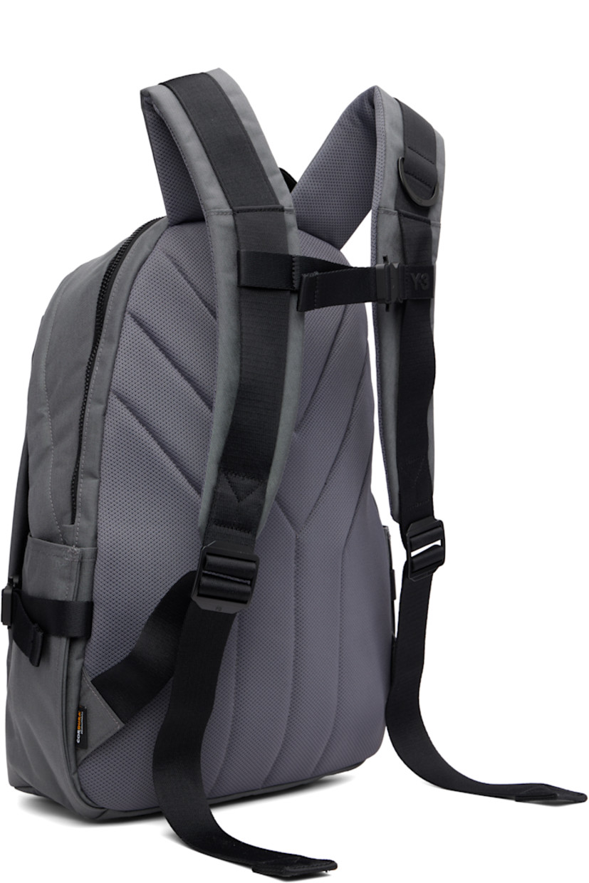 CORDURA® nylon canvas backpack. Zip compartment at base with detachable waterproof bag cover.

· Webbing carry handle
· D-ring at adjustable padded shoulder straps
· Sternum strap
· Zip pocket at face
· Logo bonded at face and shoulder strap
· Pockets with rollercoaster cinch buckles at sides
· Padded mesh back face
· Two-way zip closure
· Padded laptop compartment and patch pocket
· Satin twill lining
· H17.75" x W13" x D7.5" / 35 L

Supplier color: Granit