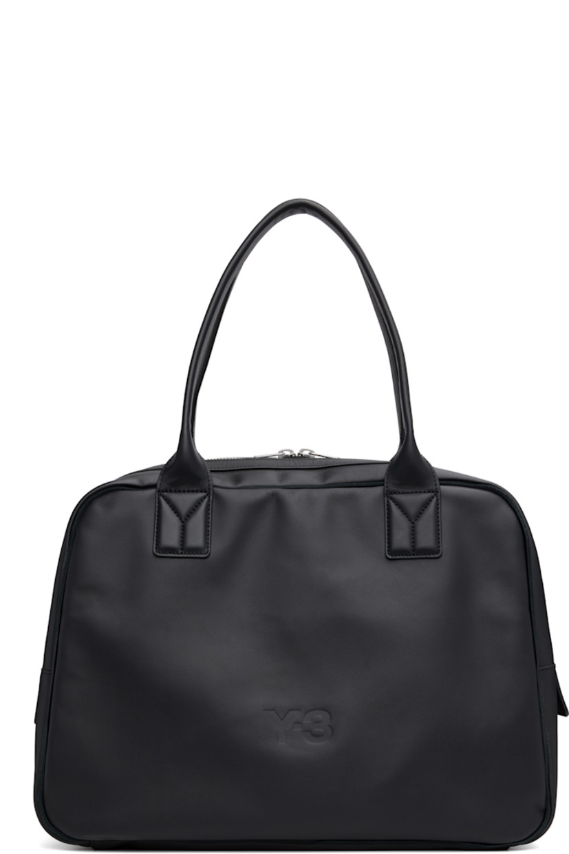 Buffed leather duffle bag.

· Twin rolled carry handles
· Logo embossed at face
· Zip pocket at back face
· Two-way zip closure
· Zip and patch pockets at interior
· Twill lining
· H13" x W17.5" x D7.25"

Supplier color: Black