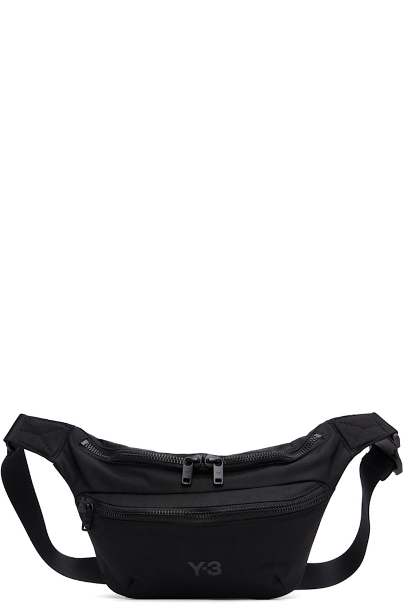 Padded CORDURA® nylon canvas belt bag.

· Adjustable crossbody strap
· Zip pocket at face
· Logo bonded at face
· Logo flag at outer side
· Zip closure
· Zip pocket at interior
· Satin twill lining
· H7" x W11" x D3.75"

Supplier color: Black