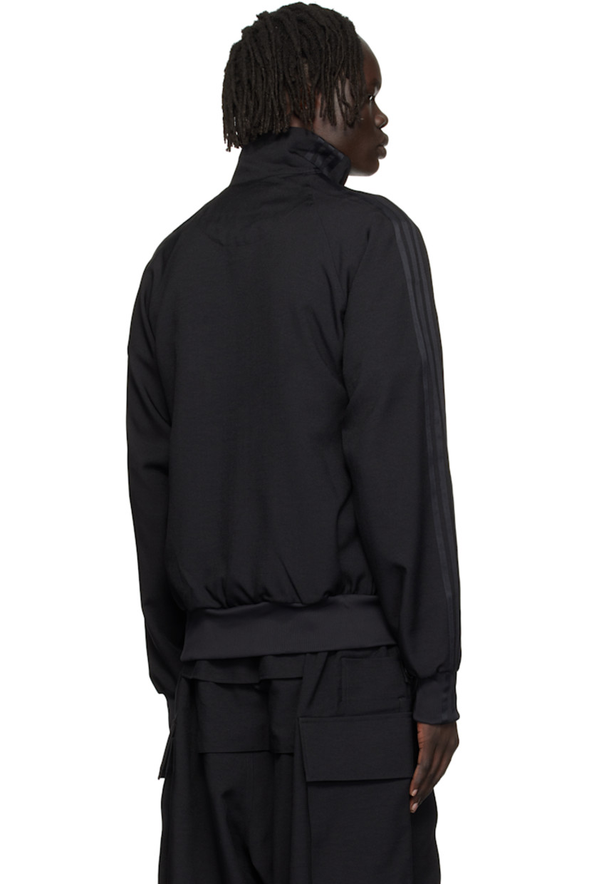 Recycled polyester twill track jacket.

· Stand collar
· Two-way zip closure
· Logo printed at chest
· Seam pockets at waist
· Stripe appliqués at raglan sleeves
· Rib-knit cuffs

Supplier color: Black