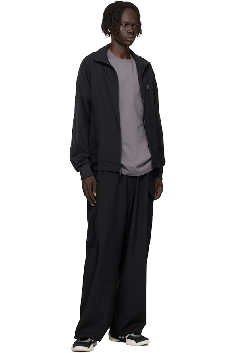 Recycled polyester twill track jacket.

· Stand collar
· Two-way zip closure
· Logo printed at chest
· Seam pockets at waist
· Stripe appliqués at raglan sleeves
· Rib-knit cuffs

Supplier color: Black