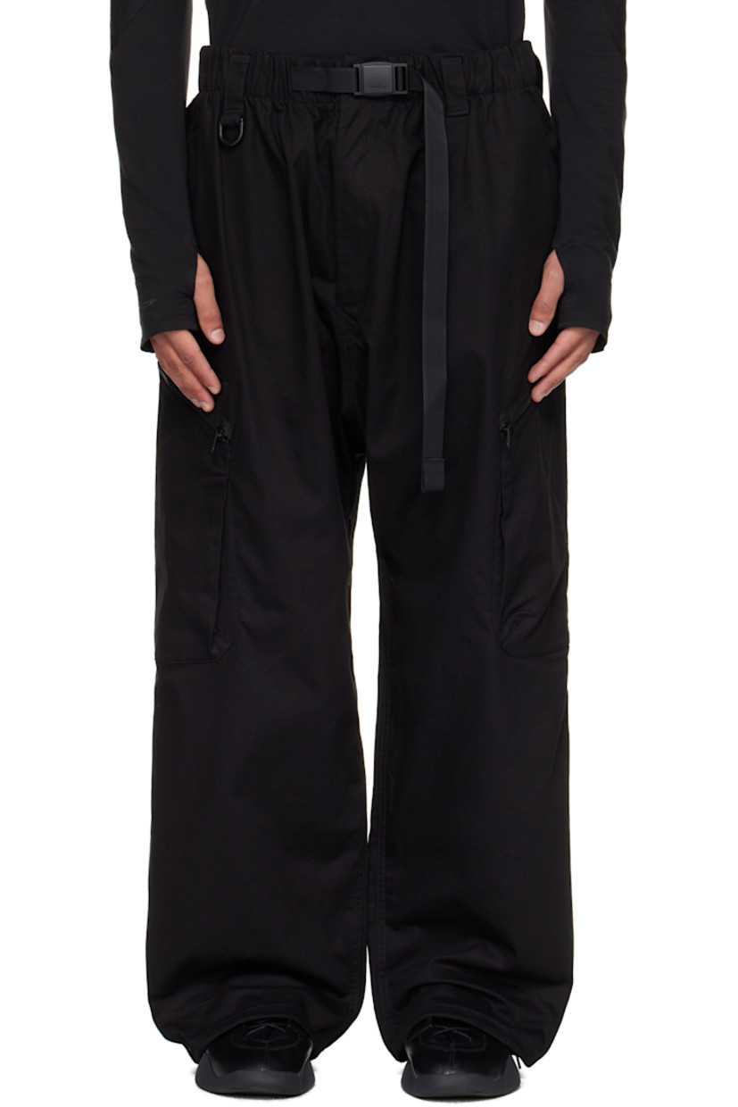 Cotton-blend twill cargo pants.

· Integrated press-release belt at elasticized waistband
· Belt loops
· Four-pocket styling
· Zip fly
· D-ring at front waistband
· Bungee-style drawstring at cuffs
· Welt pocket at outseam
· Zip pocket at outseams

Supplier color: Black