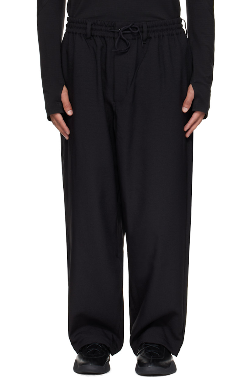 Recycled twill track pants.

· Belt loops and drawstring at elasticized waistband
· Four-pocket styling
· Zip fly
· Bungee-style drawstring at cuffs
· Stripe appliqués at outseams

Supplier color: Black