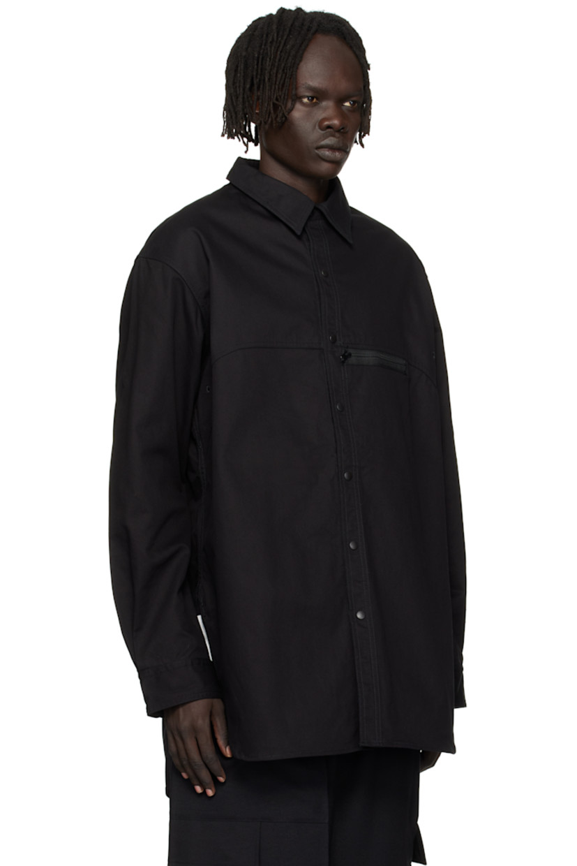 Cotton-blend twill overshirt.

· Spread collar
· Press-stud closure
· Zip pocket at chest
· Shirttail hem
· Embroidered eyelets at armscyes and back yoke
· Adjustable press-stud barrel cuffs 
· Logo bonded at back yoke

Supplier color: Black