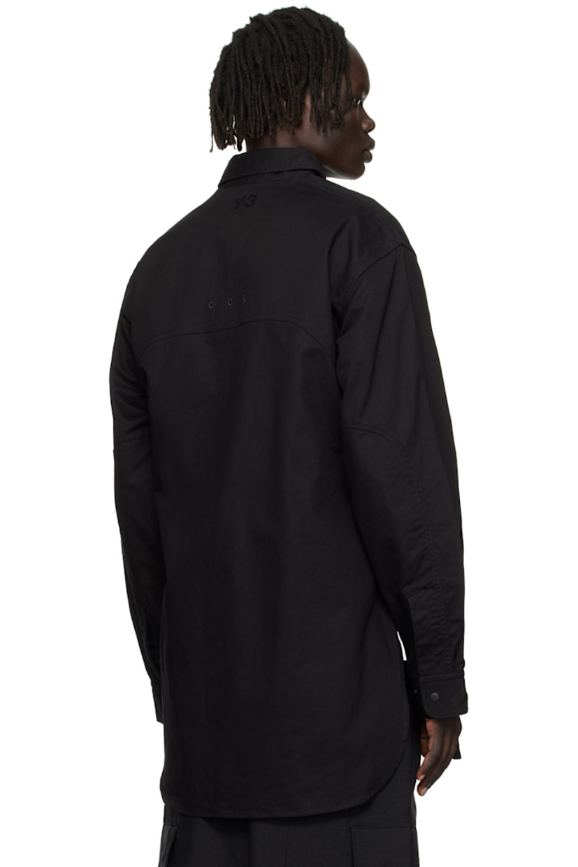 Cotton-blend twill overshirt.

· Spread collar
· Press-stud closure
· Zip pocket at chest
· Shirttail hem
· Embroidered eyelets at armscyes and back yoke
· Adjustable press-stud barrel cuffs 
· Logo bonded at back yoke

Supplier color: Black