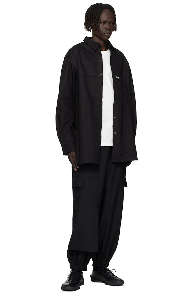 Cotton-blend twill overshirt.

· Spread collar
· Press-stud closure
· Zip pocket at chest
· Shirttail hem
· Embroidered eyelets at armscyes and back yoke
· Adjustable press-stud barrel cuffs 
· Logo bonded at back yoke

Supplier color: Black
