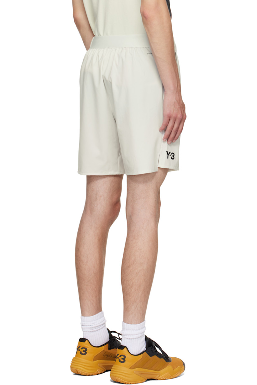 Stretch cotton-blend jersey shorts. Includes removable stretch recycled jersey compression shorts. 

· Concealed drawstring at elasticized waistband 
· Two-pocket styling
· Offset exposed seam at front 
· Bonded logo at front hem 
· Graphic printed at outseam 
· Vented outseams
· Bonded text at back waist

Part of the US Open capsule.

Supplier color: Orbit grey