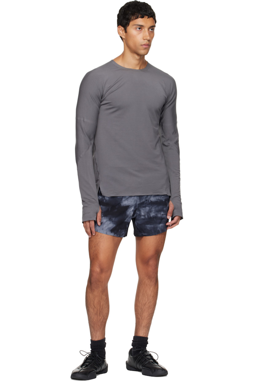 Stretch nylon seersucker shorts.

· Graphic pattern printed throughout
· Concealed drawstring at elasticized waistband
· Three-pocket styling
· Reflective logo printed at front
· Vented cuffs
· Briefs-style jersey lining

Supplier color: Black/Multicolor