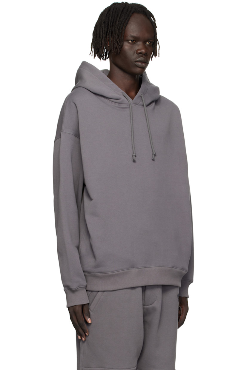 French terry hoodie. 

· Drawstring at hood
· Seam pockets at waist 
· Rib-knit hem and cuffs
· Dropped shoulders
· Logo graphics printed at back

Supplier color: Granite