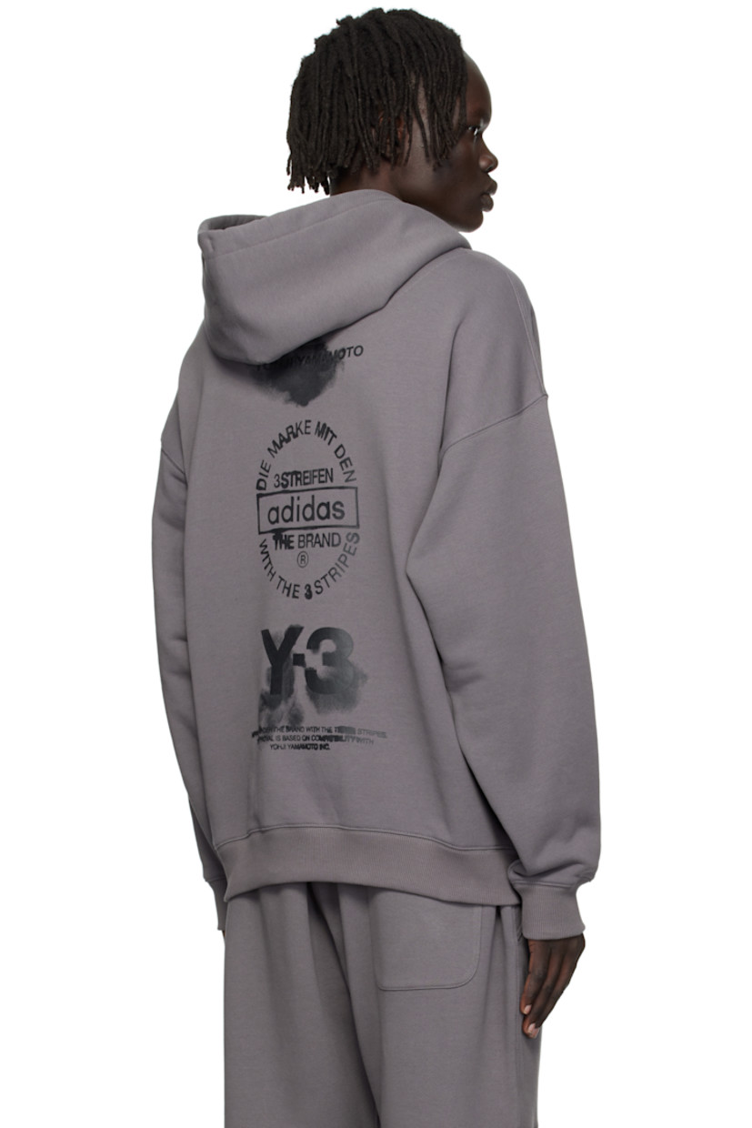 French terry hoodie. 

· Drawstring at hood
· Seam pockets at waist 
· Rib-knit hem and cuffs
· Dropped shoulders
· Logo graphics printed at back

Supplier color: Granite