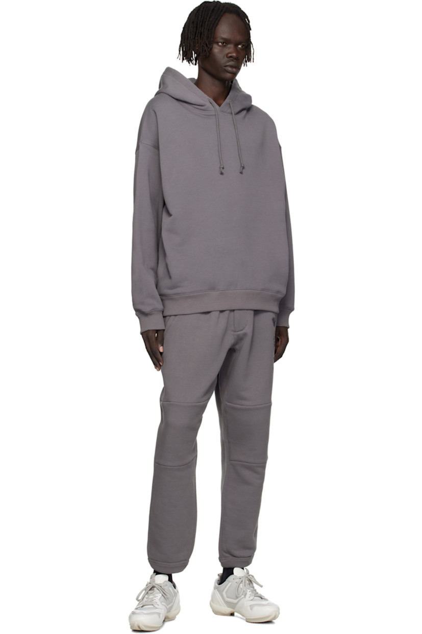 French terry hoodie. 

· Drawstring at hood
· Seam pockets at waist 
· Rib-knit hem and cuffs
· Dropped shoulders
· Logo graphics printed at back

Supplier color: Granite