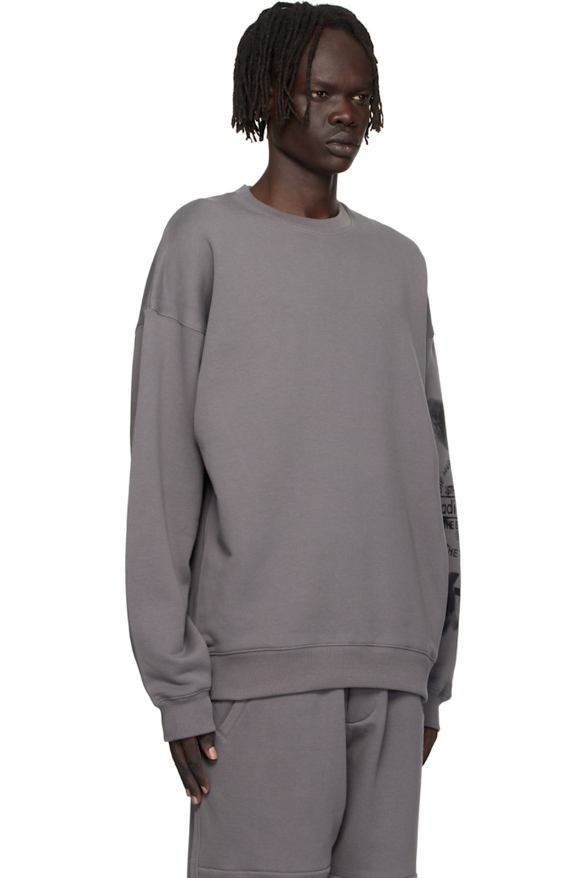 Cotton French terry sweatshirt.

· Rib-knit crewneck, hem, and cuffs
· Dropped shoulders
· Logo and text printed at sleeve

Supplier color: Granite