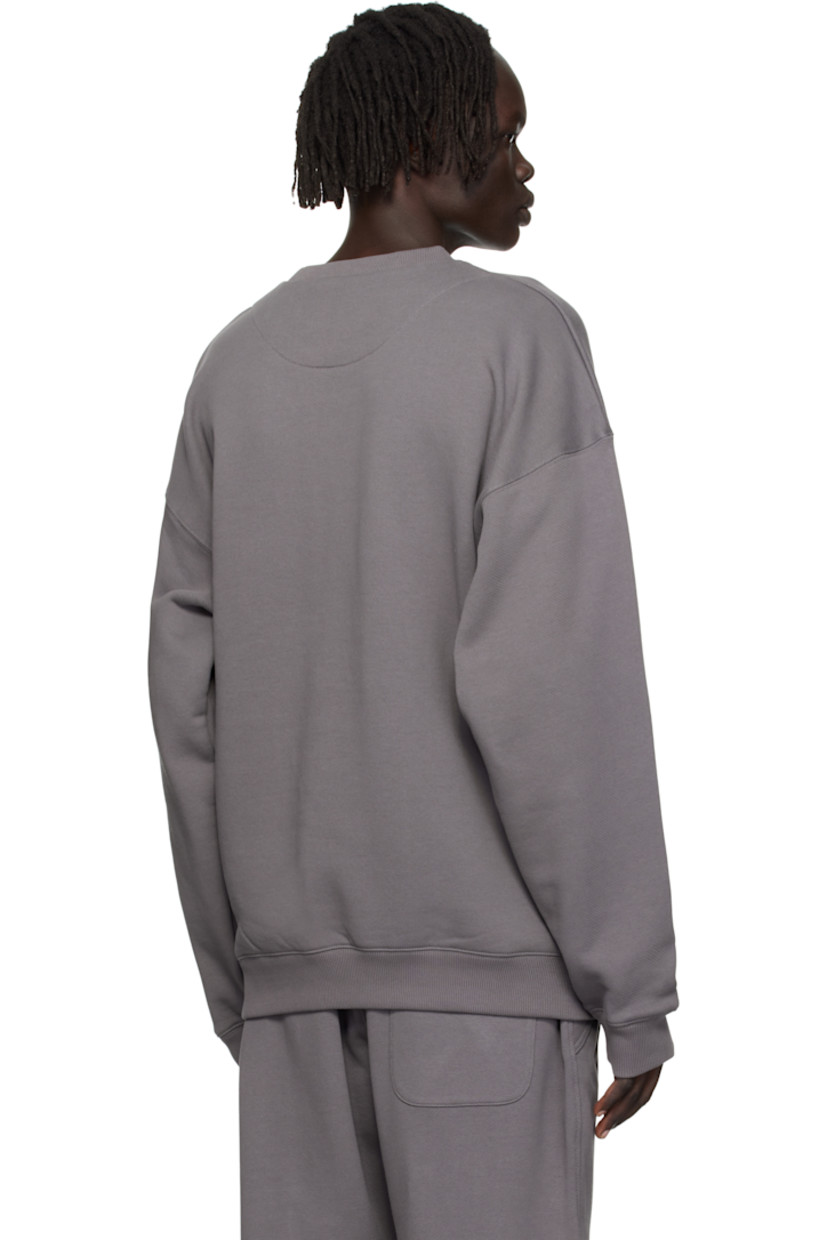 Cotton French terry sweatshirt.

· Rib-knit crewneck, hem, and cuffs
· Dropped shoulders
· Logo and text printed at sleeve

Supplier color: Granite