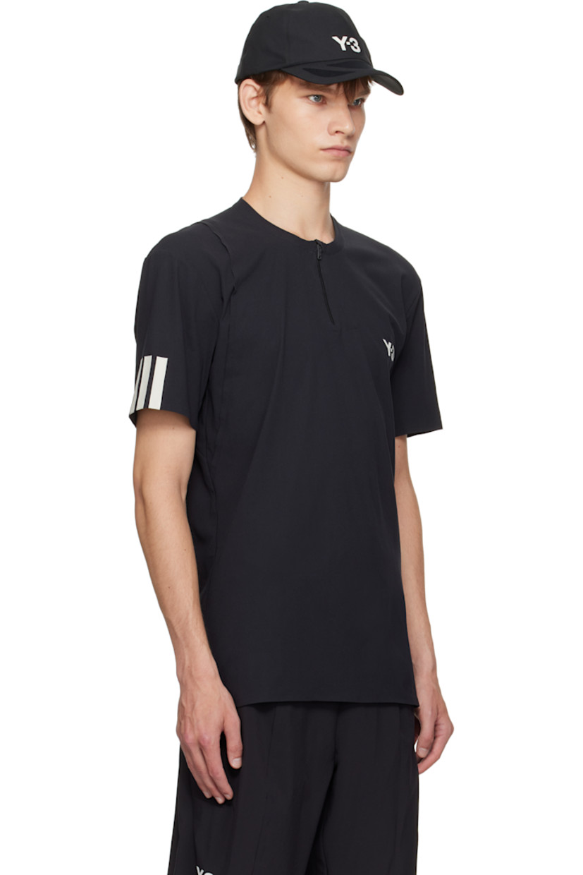 Recycled nylon-blend jersey T-shirt. 

· Crewneck
· Half-zip closure 
· Bonded logo and exposed seam at chest 
· Stripes bonded at sleeve

Part of the US Open capsule.

Supplier color: Black