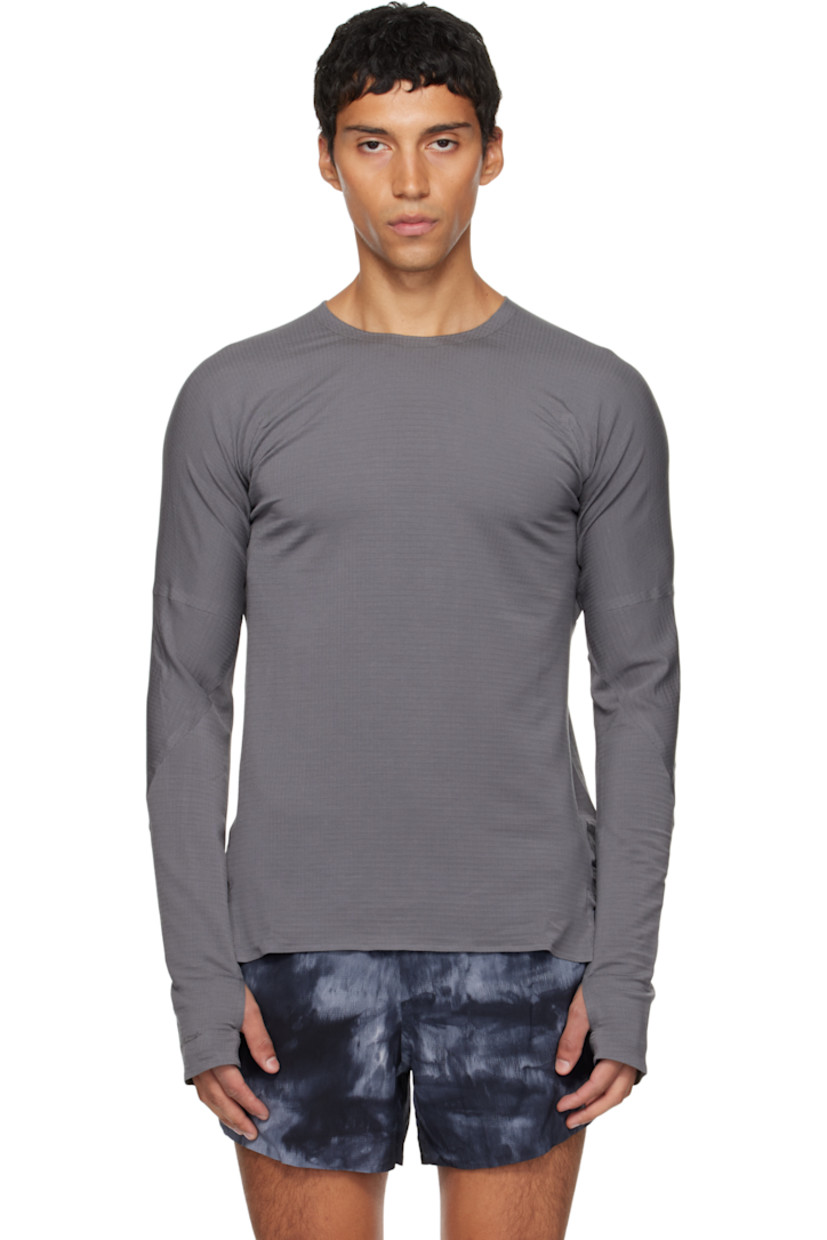 Stretch lyocell-blend jersey T-shirt.

· Raw edges throughout
· Crewneck
· Vented side seams
· Dropped shoulders
· Thumbhole at cuffs
· Reflective logo printed at back collar

Supplier color: Granit