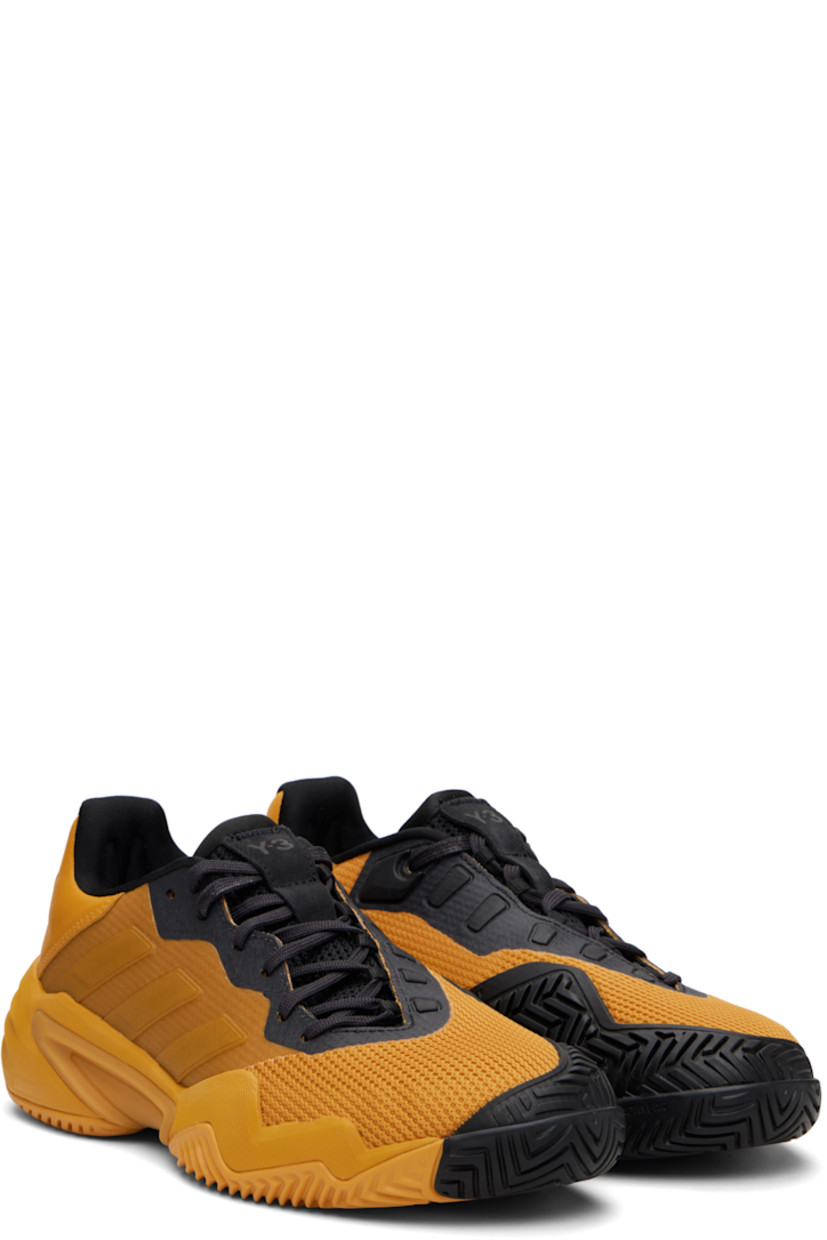Low-top mesh sneakers.

· Offset lace-up closure
· Logo printed at tongue and heel tab
· Padded tongue and collar
· Bonded trim at sides
· Signature stripes at outer side
· Jersey lining
· Foam rubber midsole
· Treaded rubber sole

Part of the US Open capsule.

Supplier color: Collegiate gold/Collegiate gold