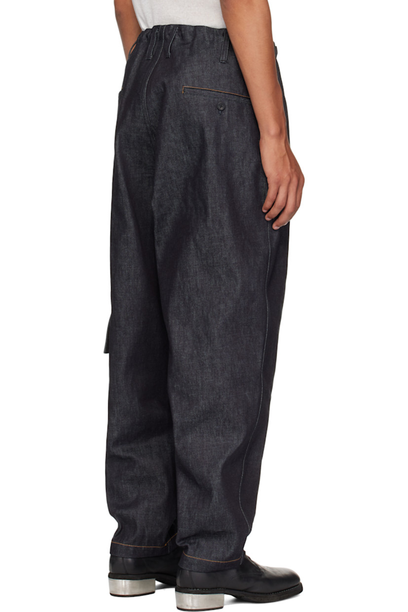 13 oz non-stretch denim cargo pants. 

· Drawstring at waistband
· Belt loops
· Four-pocket styling
· Zip fly
· Flap pocket at outseam
· Contrast stitching in tan

Supplier color: Indigo