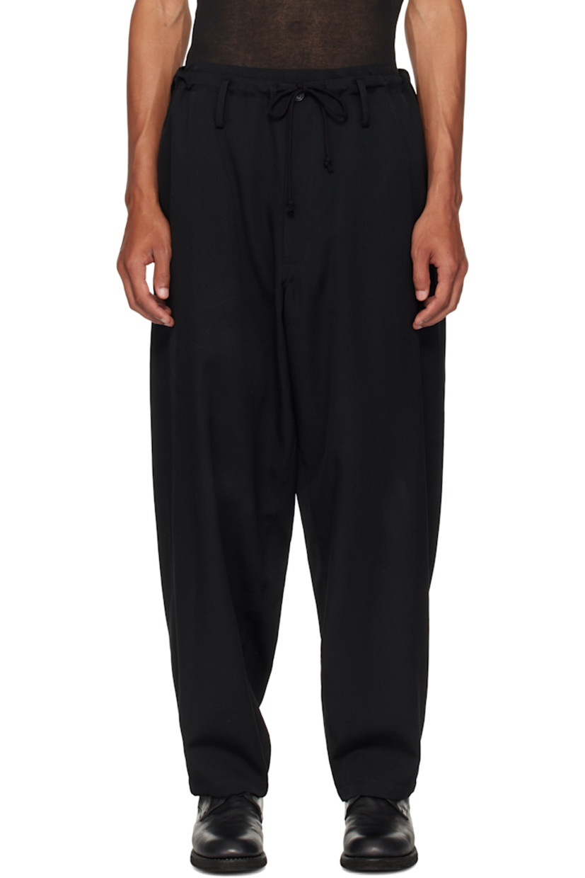 Wool gabardine trousers.

· Loose-fit
· Drawstring at waistband
· Belt loops
· Four-pocket styling
· Zip fly

Supplier color: Black