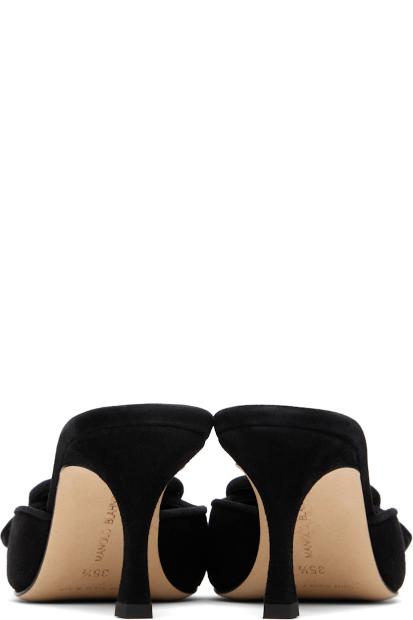 Handcrafted goatskin suede slip-on heeled sandals.

· Pointed toe
· Covered buckle hardware at vamp
· Inset logo patch at padded footbed
· Buffed kidskin lining
· Covered stiletto heel with rubber injection
· Calfskin nubuck sole
· Heel: H2.75"

Supplier color: Black