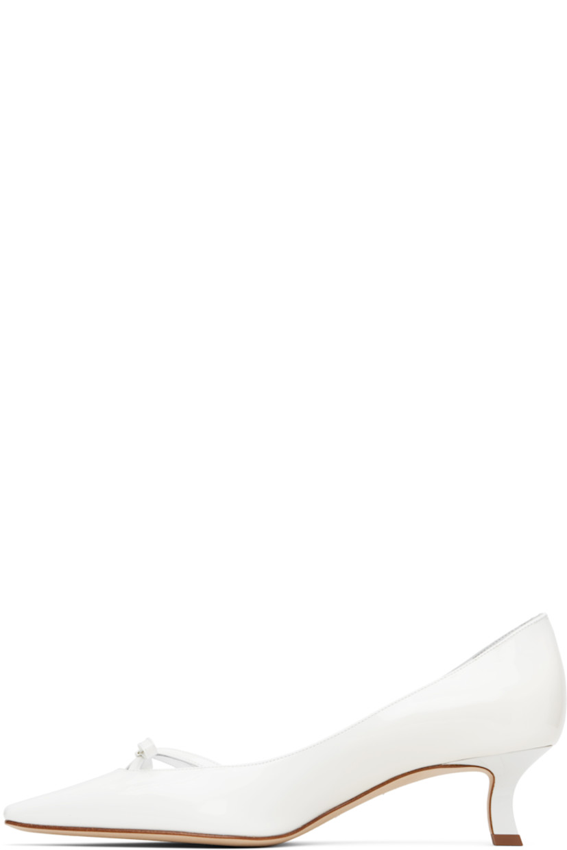 Handcrafted patent calfskin heels. 

· Pointed toe
· Bow accent and cutouts at vamp
· Buffed goatskin lining
· Covered kitten heel with rubber injection
· Nubuck sole
· Heel: H2"

Supplier color: White