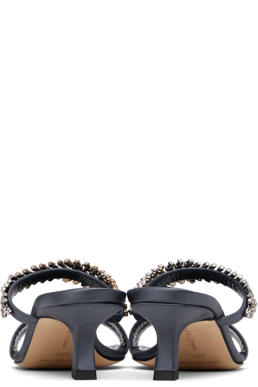 Satin mules.

· Open toe
· Elasticized strap with crystals at vamp
· Logo patch at padded footbed
· Buffed kidskin lining
· Covered kitten heel with rubber injection
· Calfskin lining
· Heel: H1.75"

Supplier color: Navy