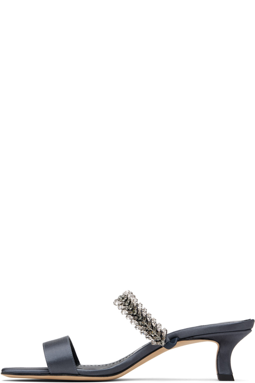Satin mules.

· Open toe
· Elasticized strap with crystals at vamp
· Logo patch at padded footbed
· Buffed kidskin lining
· Covered kitten heel with rubber injection
· Calfskin lining
· Heel: H1.75"

Supplier color: Navy