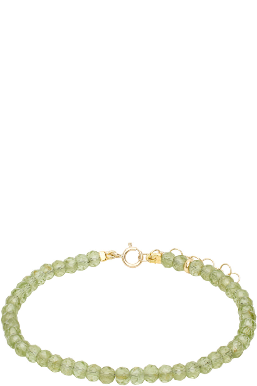 Handcrafted beaded peridot bracelet in green.

· Adjustable spring-ring fastening
· 14k gold hardware
· L7"

Supplier color: Peridot