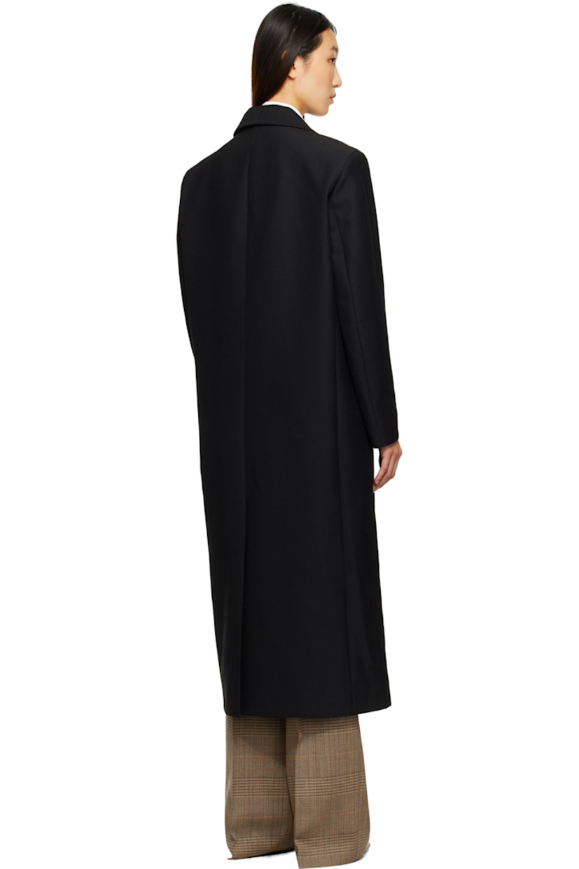 Virgin wool-blend grain de poudre coat.

· Shawl lapel
· Double-breasted button closure
· Welt pockets at front
· Padded shoulders
· Central vent at back hem
· Satin twill lining

Supplier color: Black