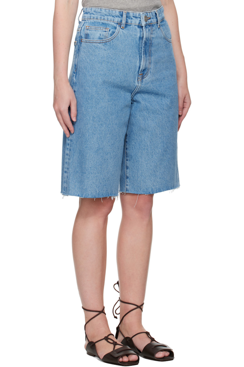 Loose-fit non-stretch denim shorts. Fading and subtle distressing throughout. 

· Belt loops
· Five-pocket styling
· Zip fly
· Raw edge at cuffs
· Logo-engraved silver-tone hardware
· Contrast stitching in tan

Supplier color: Denim blue