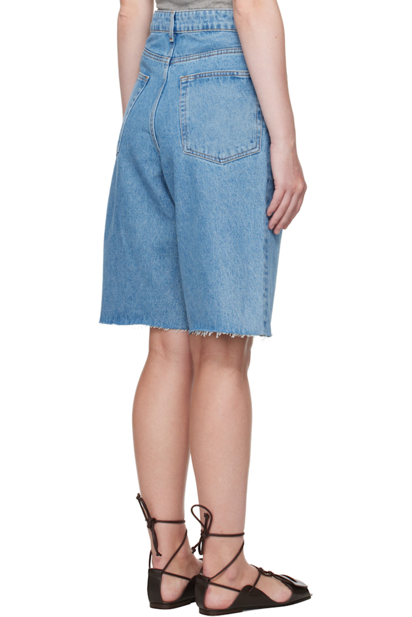 Loose-fit non-stretch denim shorts. Fading and subtle distressing throughout. 

· Belt loops
· Five-pocket styling
· Zip fly
· Raw edge at cuffs
· Logo-engraved silver-tone hardware
· Contrast stitching in tan

Supplier color: Denim blue