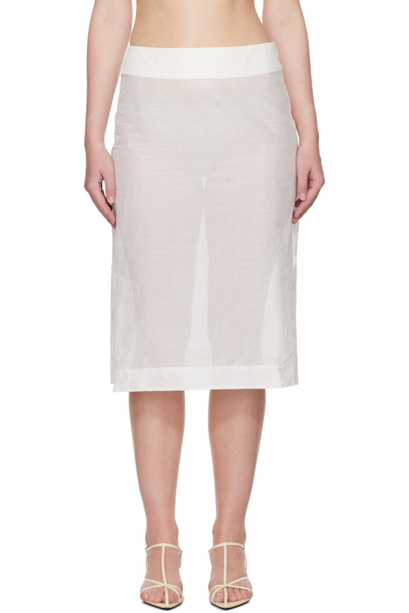 Semi-sheer cotton organza midi skirt. 

· Embroidered floral pattern at hem and side seams
· Slit at side seams 
· Concealed zip closure at side
· Darts at back waistband
· Unlined

Supplier color: Off white
